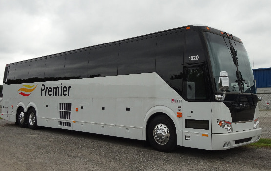 a charter bus with the Orlando Premier Charter Bus logo on the side